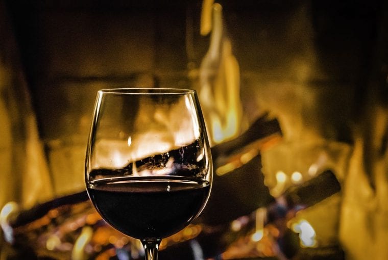 wine in front of a fire