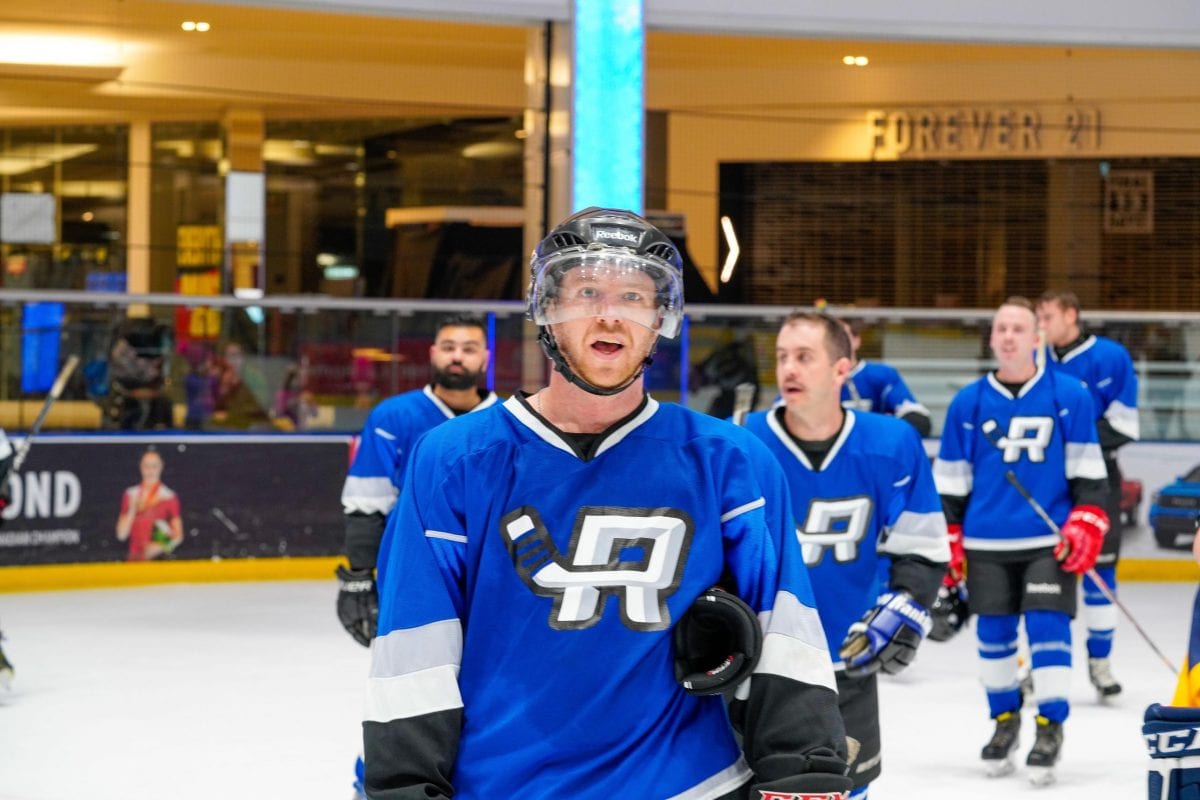 a group of men playing hockey