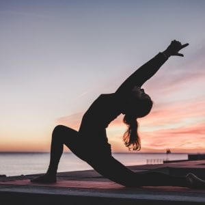 woman doing yoga outside
