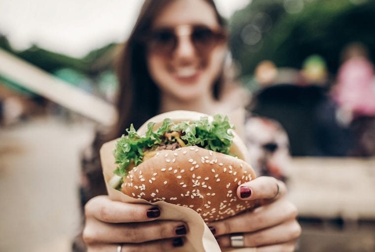 woman eating a hamburger