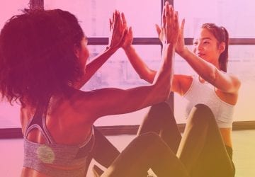 women in the gym exercising together