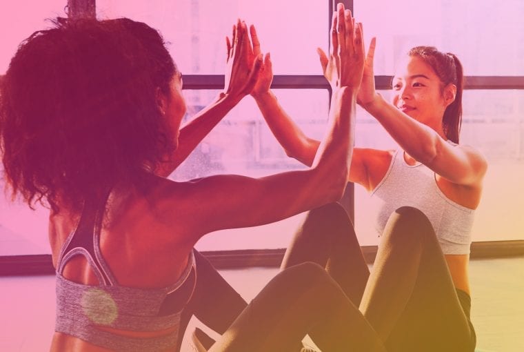 women in the gym exercising together