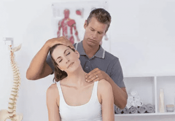 a chiropractor treating a patient