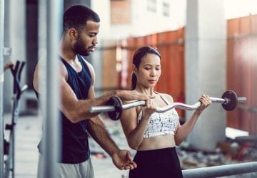 a personal trainer working with their client