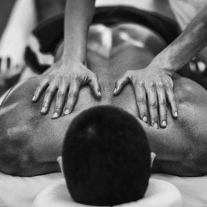 Physical therapist doing massage of male's back