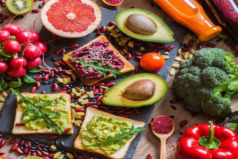 a table loaded with healthy foods