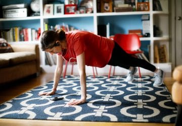a woman exercising in her living room