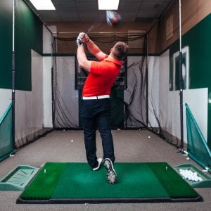a golfer practicing their swing
