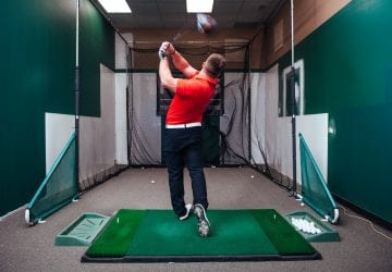 a golfer practicing their swing