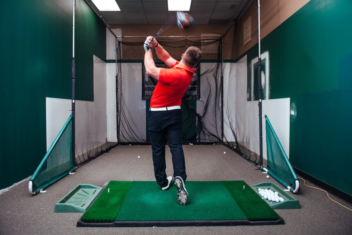 a golfer practicing their swing