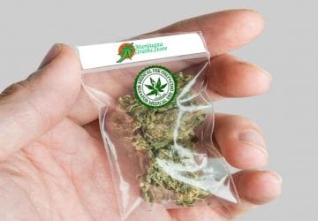 a person holding a package of cannabis