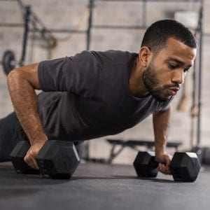a man doing renegade rows