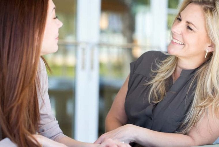 a couple talking and smiling