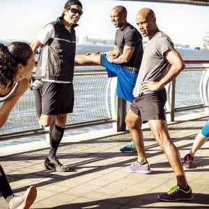 a group of people exercising outdoors