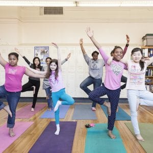 students doing yoga