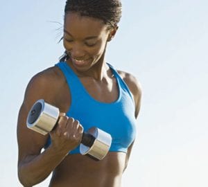 a woman doing bicep curls