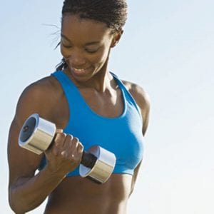 a woman doing bicep curls