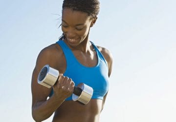 a woman doing bicep curls