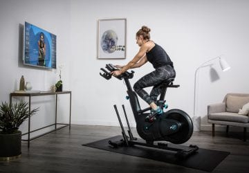 a woman spinning on an exercise bike