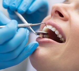 a woman receiving dental work