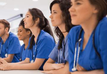 a group of nursing students sitting in a classroom