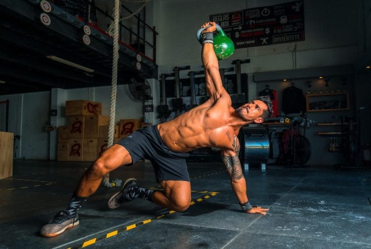 a man working out with a kettlebell