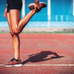 a woman stretching her legs