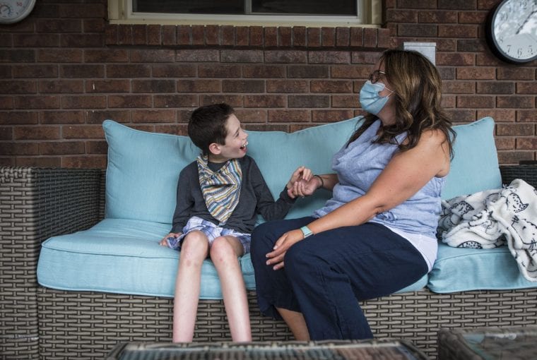 a child talking to their care giver