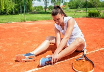 an injured woman on a tennis court
