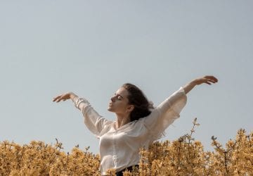 a woman in a flower field
