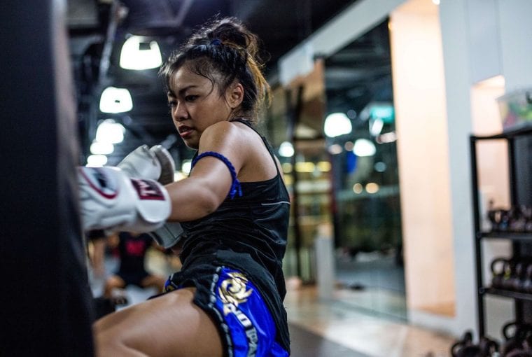 a woman kickboxing