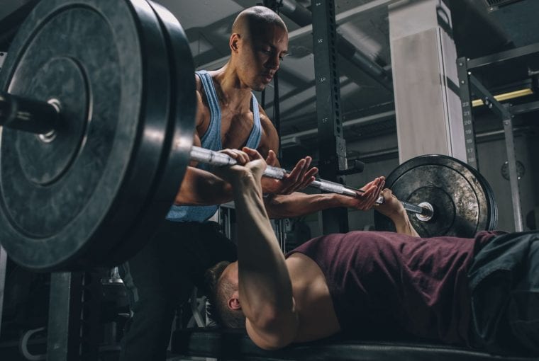 men doing bench press
