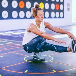 a woman doing a pistol squat