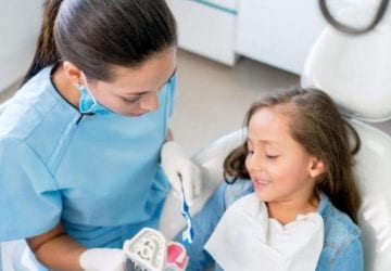 a young girl at the dentist