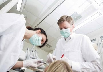 dentists working with a patient