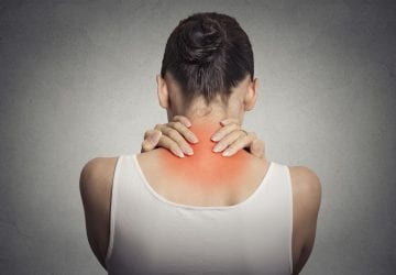 a woman with neck pain