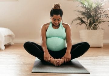 a pregnant woman stretching