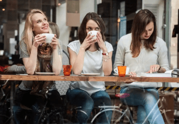a group of women drinking tea