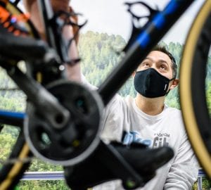 a man fitting a bike