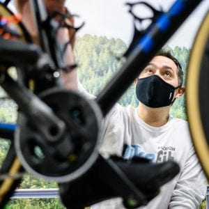 a man fitting a bike