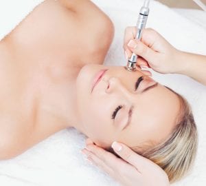 a woman receiving a spa treatment