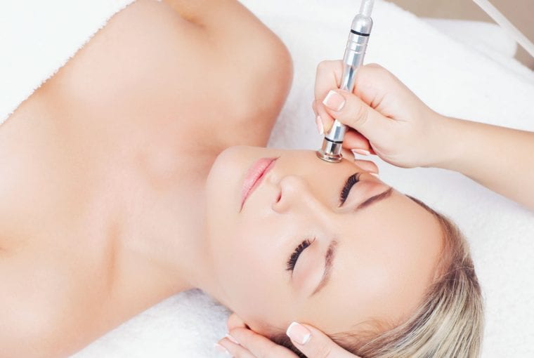 a woman receiving a spa treatment