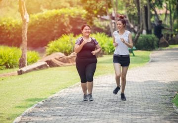 Two Asian girl running jogging in the Park
