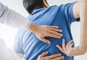 Physical Doctor consulting with patient about Back problems Physical therapy concept