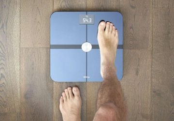 a person stepping onto a scale