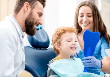 a happy family at the dentist