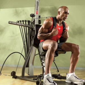 a man exercising with a Bowflex Xceed