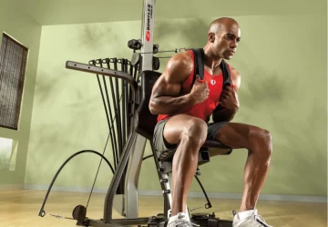a man exercising with a Bowflex Xceed