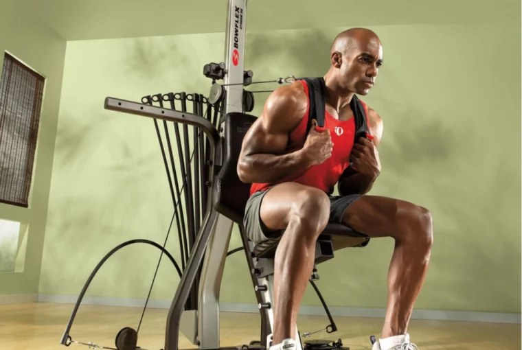 a man exercising with a Bowflex Xceed