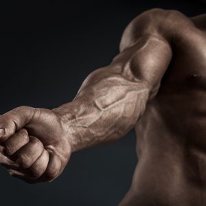 a man flexing their forearms